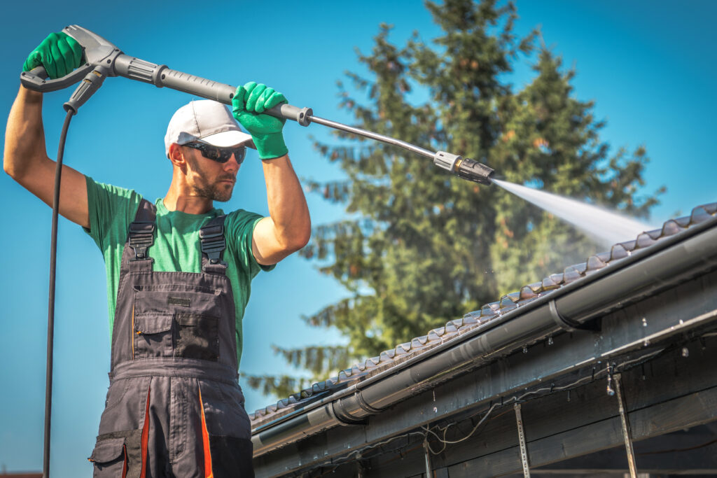 Roof cleaning removing moss algae from concrete tiles County Durham